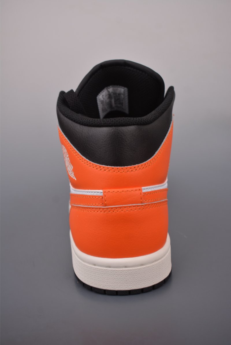 Air Jordan 1 Mid 'Black / White / Orange' view