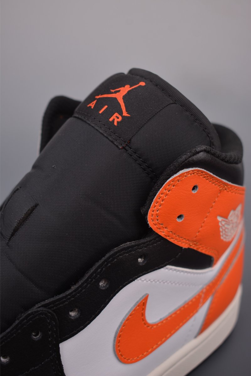 Air Jordan 1 Mid 'Black / White / Orange' view