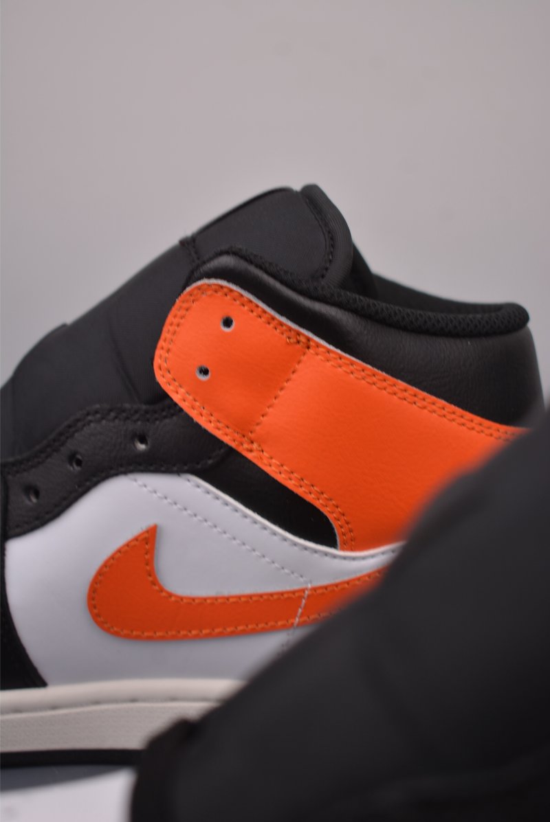 Air Jordan 1 Mid 'Black / White / Orange' view