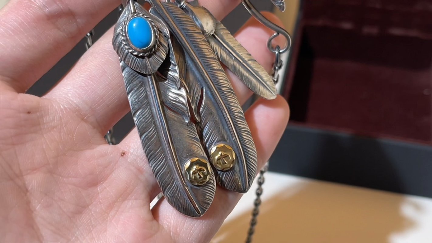 Silver Feather Pendant with Turquoise Stone