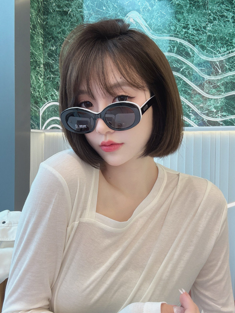 Miu Miu SMU 109Z Black Oval Sunglasses view