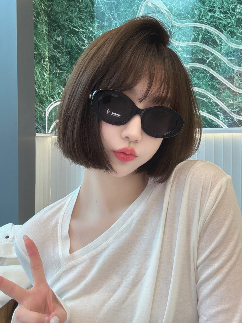 Miu Miu SMU 109Z Black Oval Sunglasses view