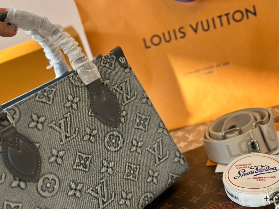 Louis Vuitton On The Go Medium Monogram Empreinte Bag Grey view