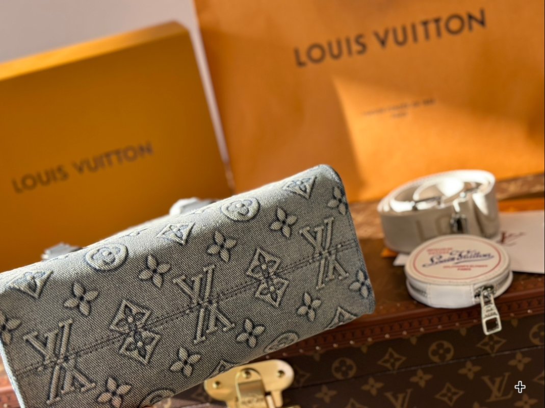 Louis Vuitton On The Go Medium Monogram Empreinte Bag Grey view