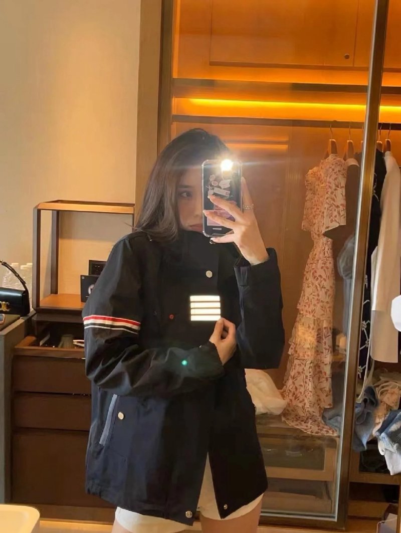 Navy Puffer Jacket with Striped Cuff Detail view