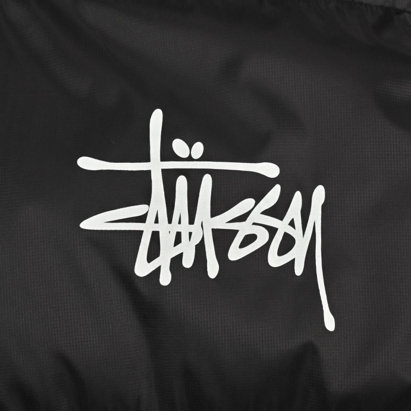 Stüssy Black Puffer Jacket with Pink Hood Lining view
