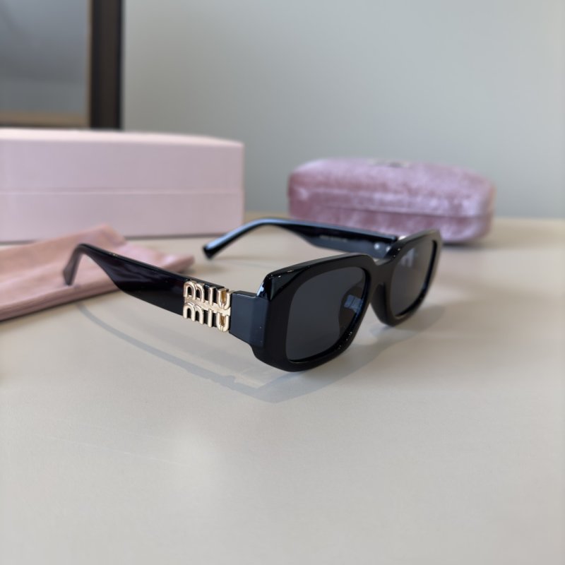 Miu Miu Black Oval Sunglasses with Metal Logo Detail
