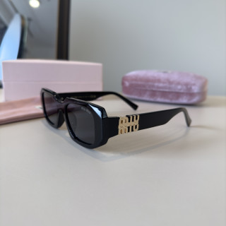 Miu Miu Black Oval Sunglasses with Metal Logo Detail view 3