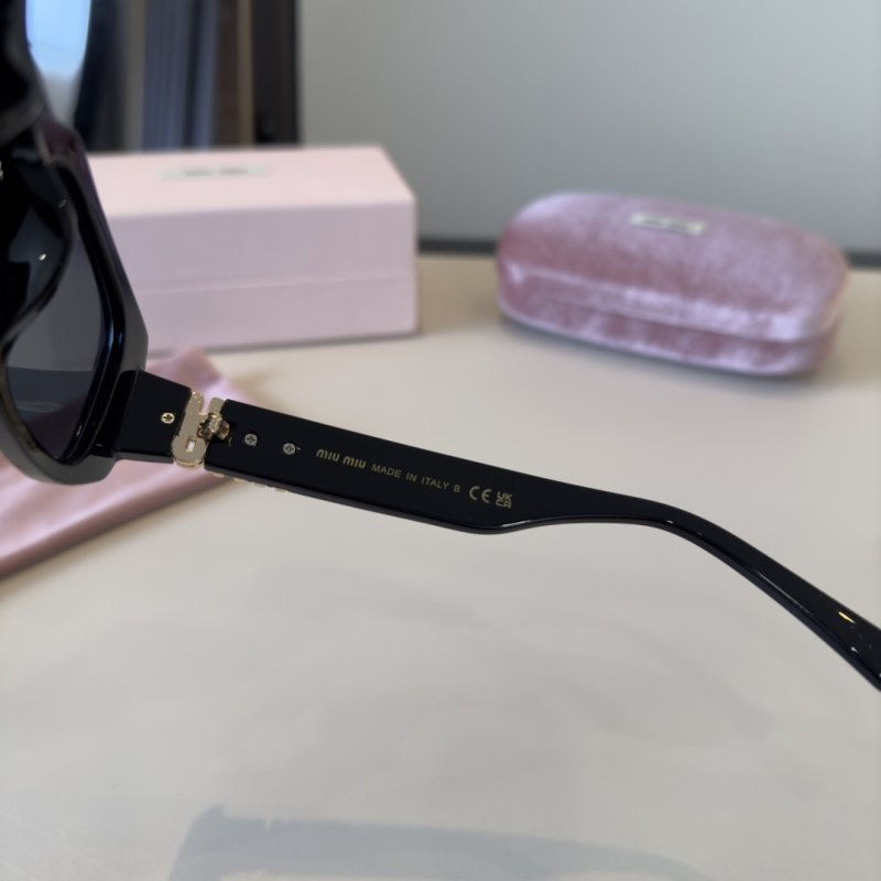 Miu Miu Black Oval Sunglasses with Metal Logo Detail view