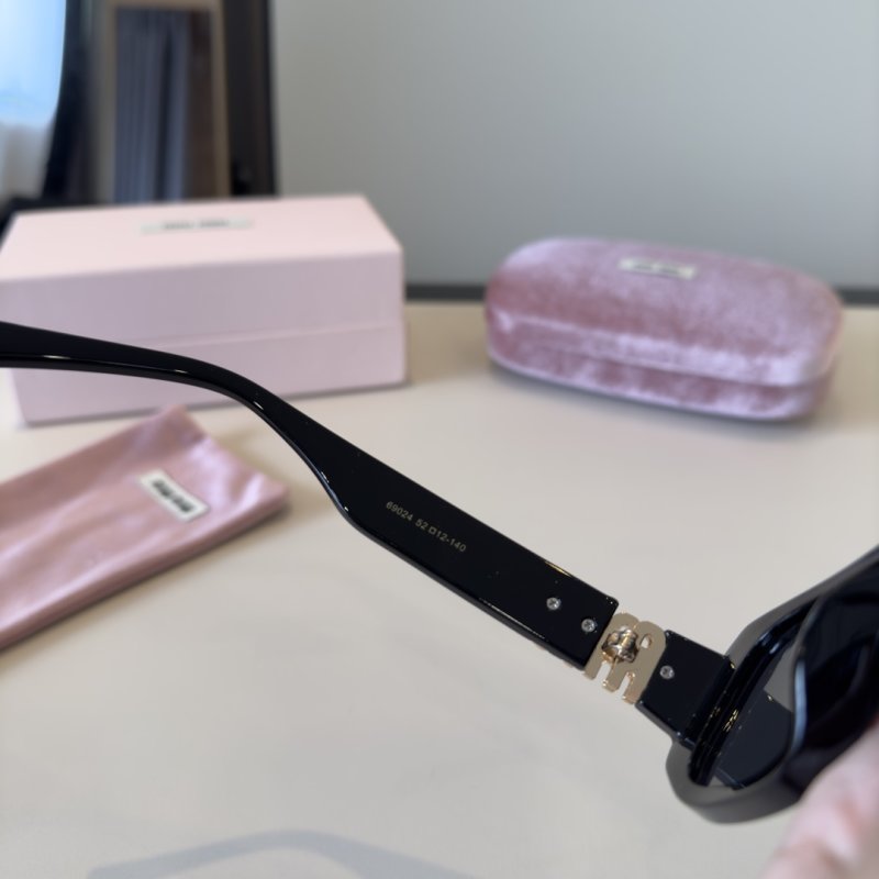 Miu Miu Black Oval Sunglasses with Metal Logo Detail view