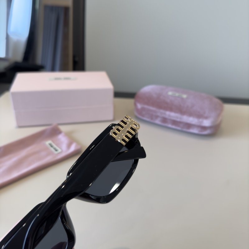 Miu Miu Black Oval Sunglasses with Metal Logo Detail view
