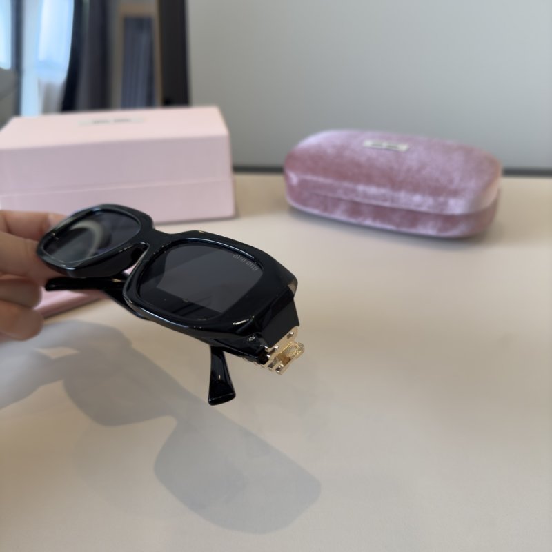 Miu Miu Black Oval Sunglasses with Metal Logo Detail view