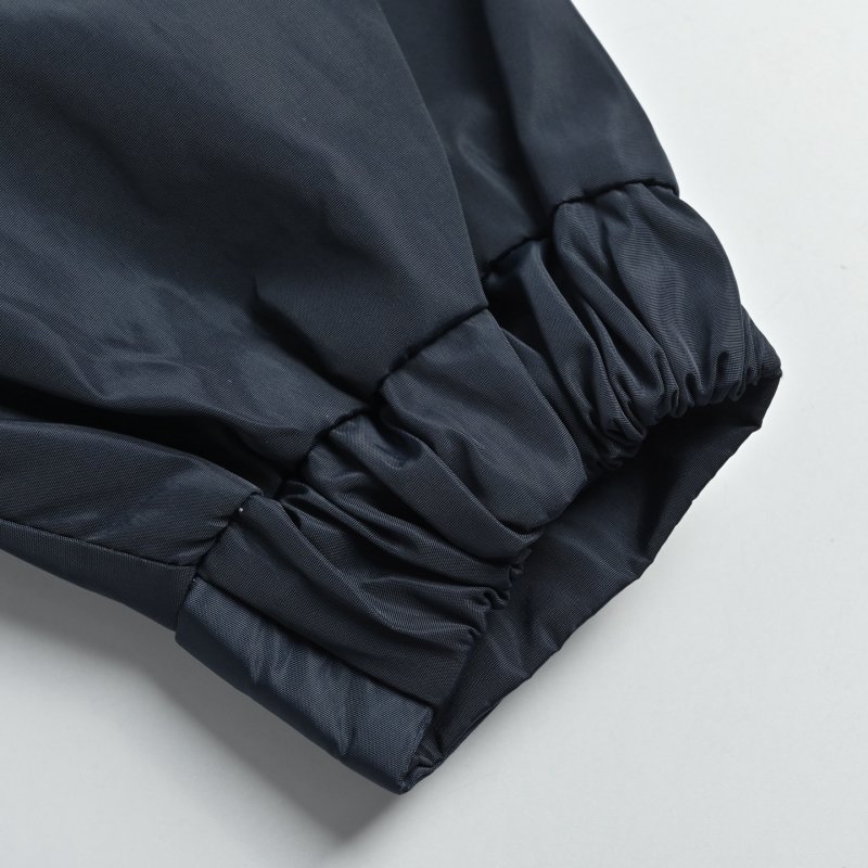 Navy Puffer Jacket with Striped Cuff Detail view