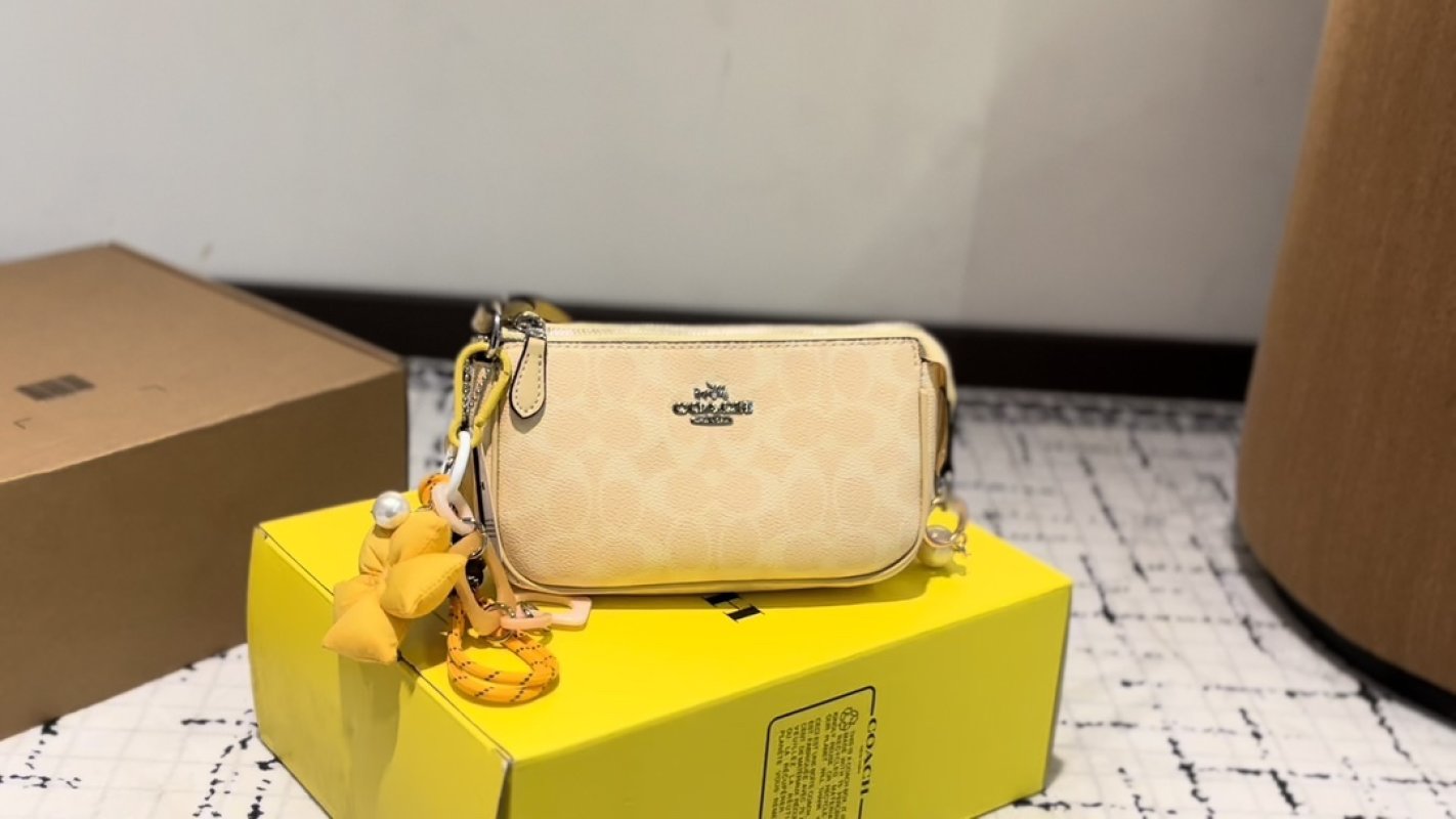 Coach Cream Leather Crossbody Bag with Yellow Charm