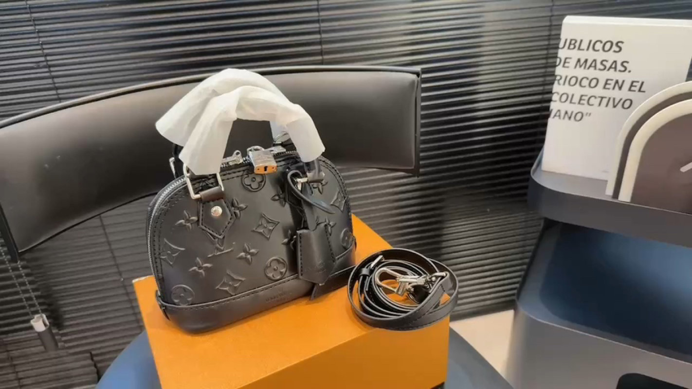 Louis Vuitton Monogram Embossed Black Handbag with Strap