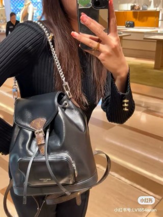 Louis Vuitton Black Leather Backpack with Chain Detail view 6
