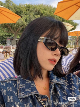 Miu Miu Black Oval Sunglasses with Gold Accent view 2