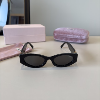 Miu Miu Black Oval Sunglasses with Gold Accent view 4