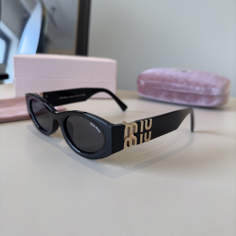Miu Miu Black Oval Sunglasses with Gold Accent view