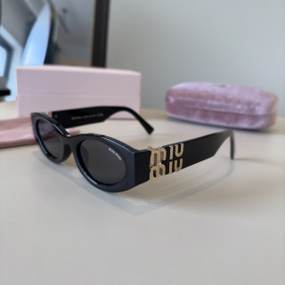 Miu Miu Black Oval Sunglasses with Gold Accent view 5