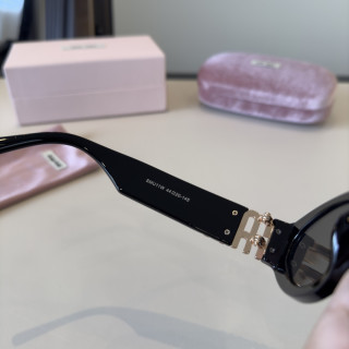 Miu Miu Black Oval Sunglasses with Gold Accent view 7