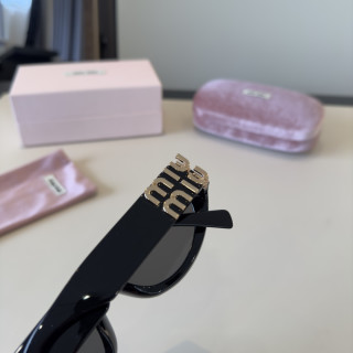 Miu Miu Black Oval Sunglasses with Gold Accent view 8