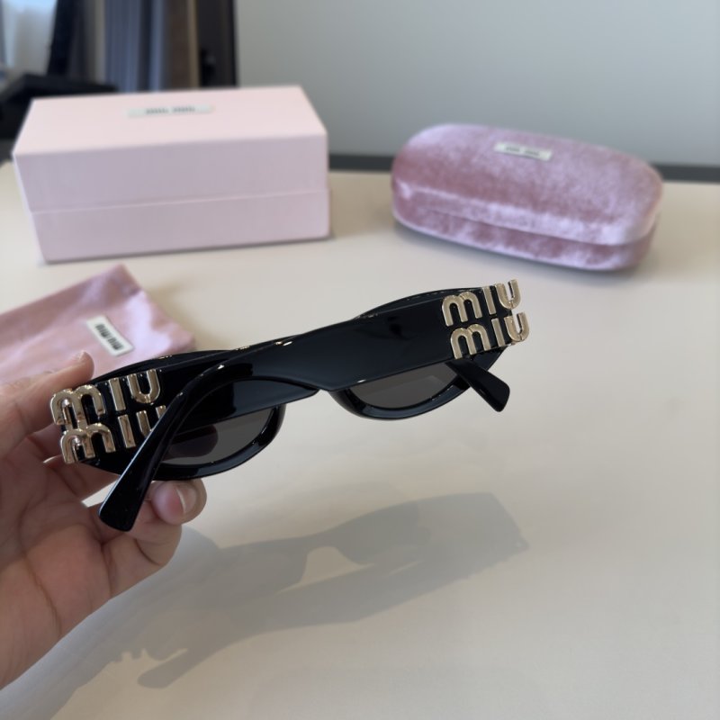 Miu Miu Black Oval Sunglasses with Gold Accent view