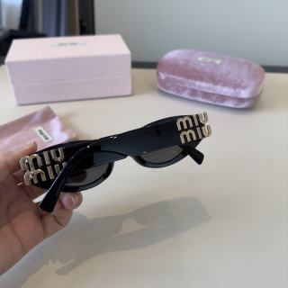 Miu Miu Black Oval Sunglasses with Gold Accent view 9
