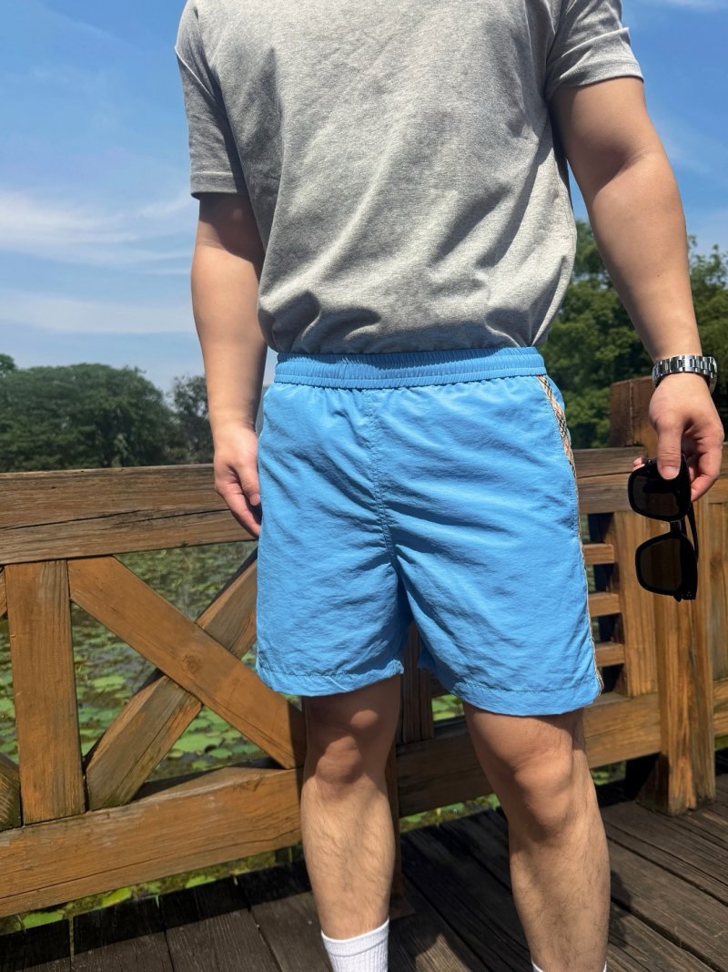 Sky Blue Nylon Shorts with Checkered Tape Detail view