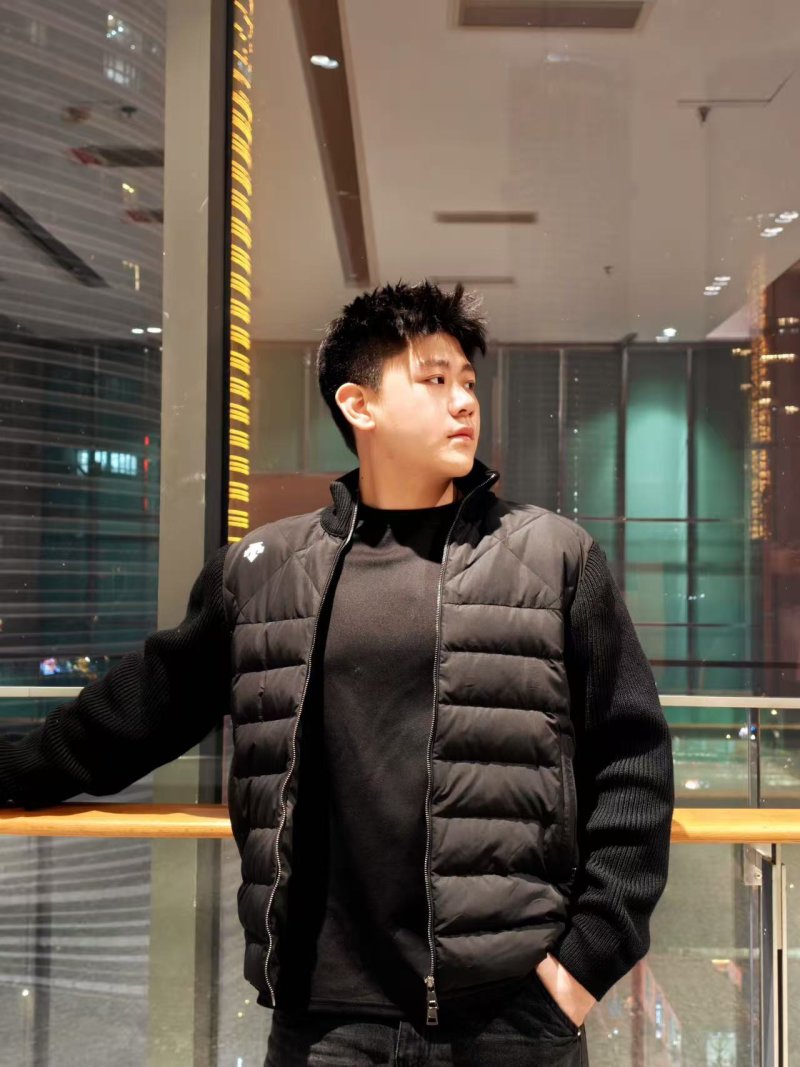 Black Puffer Down Jacket with Ribbed Knit Sleeves