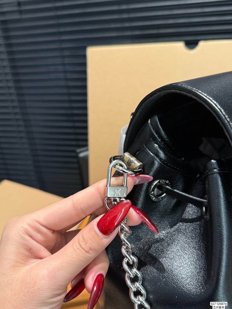Louis Vuitton Black Leather Backpack with Chain Detail view