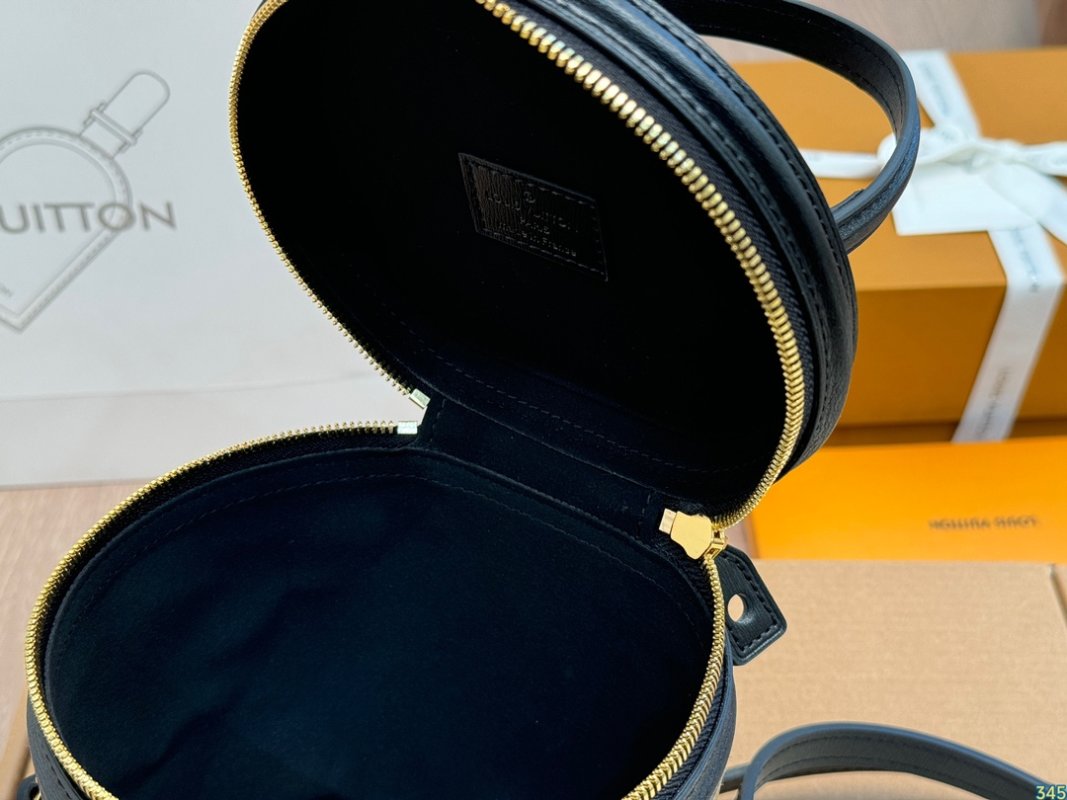 Louis Vuitton Monogram Canvas Cylinder Bucket Bag Black & Tan view